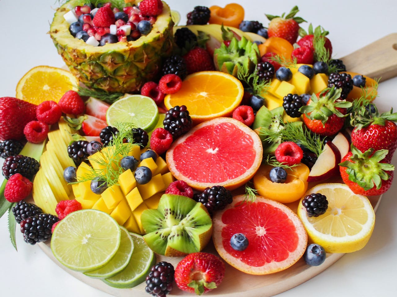 Home A vibrant assortment of fresh fruits beautifully arranged on a platter, perfect for a healthy and delicious snack.